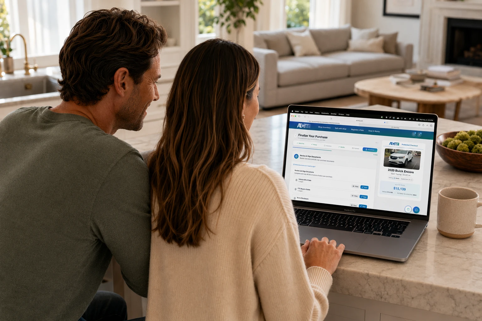 Buyers reviewing ACar purchase documents together on a laptop
